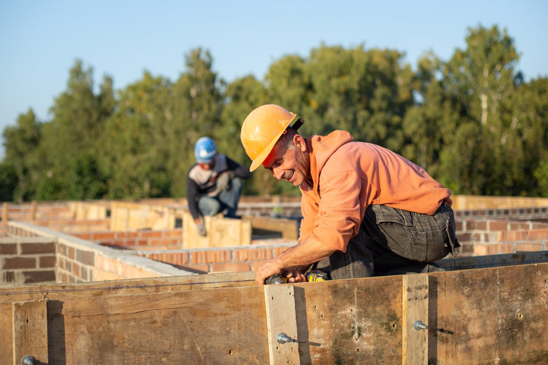 Construction workers with safety helmets on site